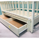 Кроватка для новорожденного с маятником и ящиком молочная