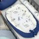 Сатиновий позиціонер кокон на поліуретановому зйомному матраці для новонароджених Діно синій